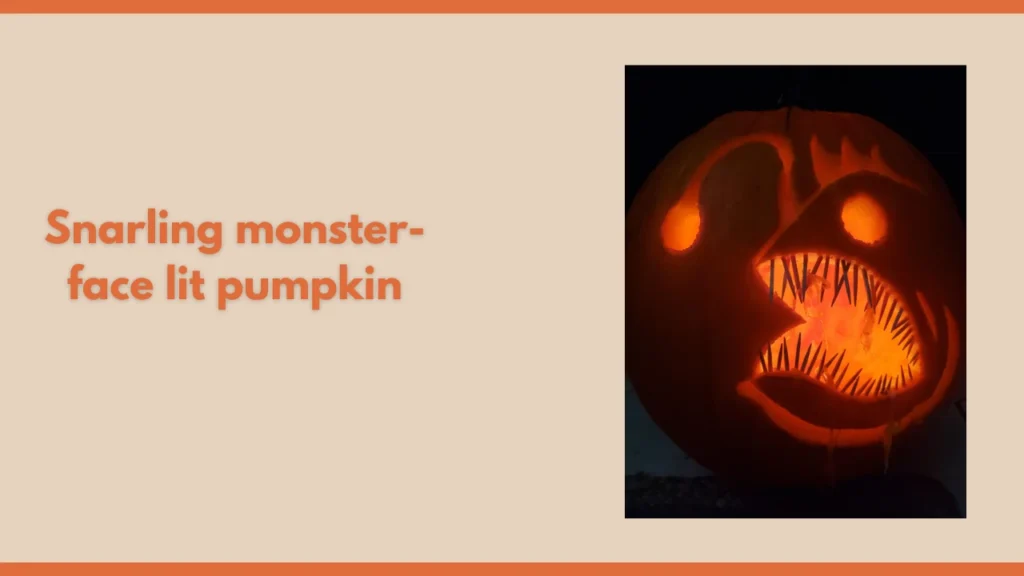 Snarling monster-face lit pumpkin
